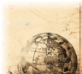 Antique terrestrial globe and rolled navigation charts